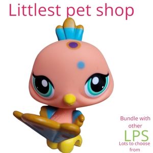 Hasbro Littlest Pet Shop peach bird blue purple accents green eyes collectible